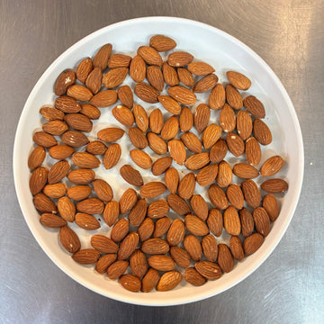 Bowl of healthy crispy almonds displayed beautifully, perfect for snacking and nutritious eating