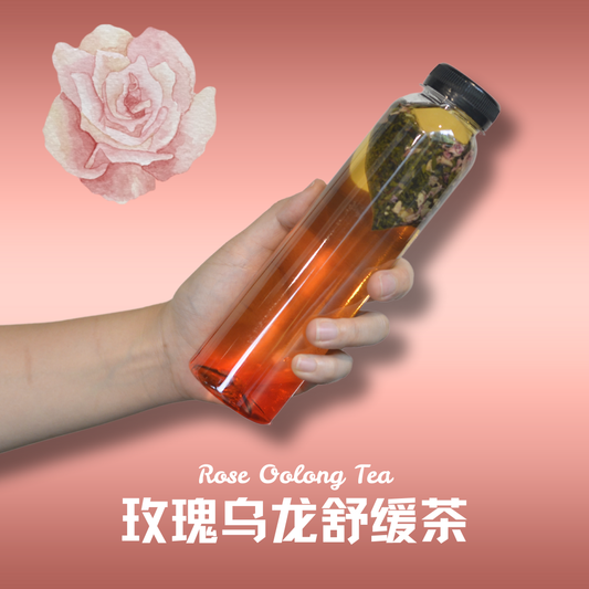 Hand holding a clear bottle of Rose Oolong Tea showcasing its floral benefits and vibrant color