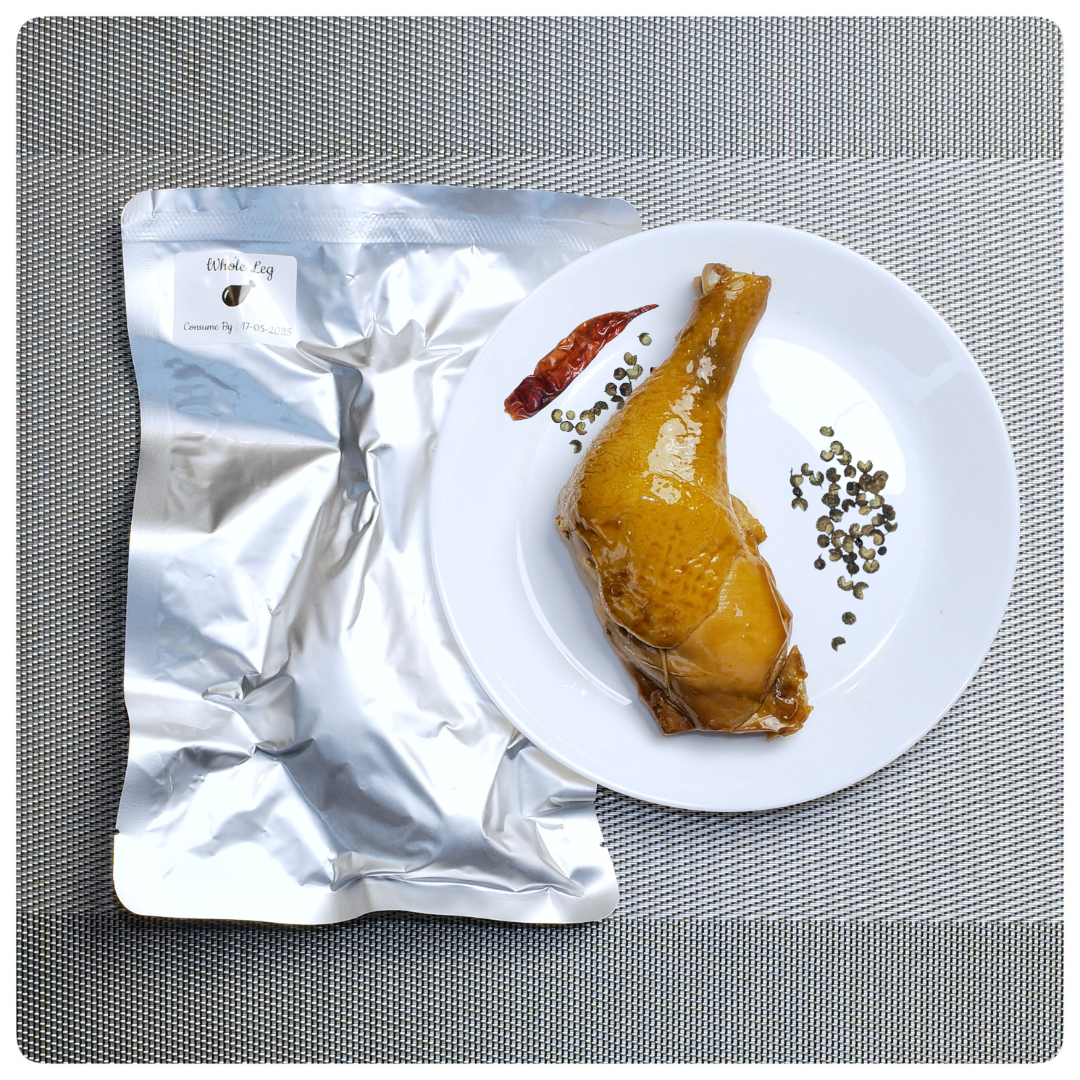 OKA-OKA whole chicken leg à la carte served on a plate with seasoning and packaging