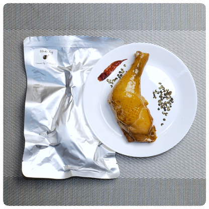OKA-OKA whole chicken leg à la carte served on a plate with seasoning and packaging